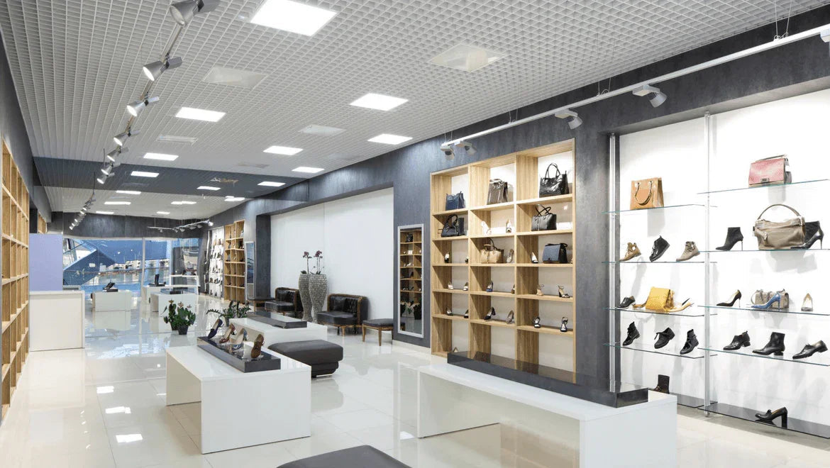 Modern retail store with handbags and shoes, bright lighting, and organized displays