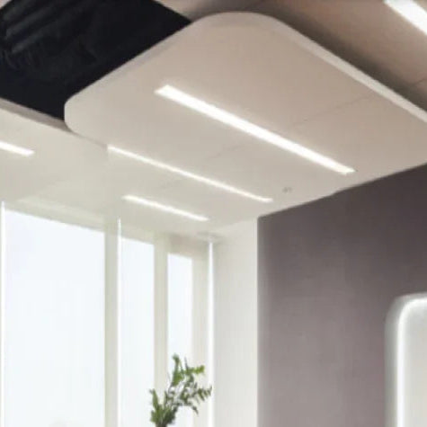 LED tube lights in modern office with large windows and ceiling light fixtures